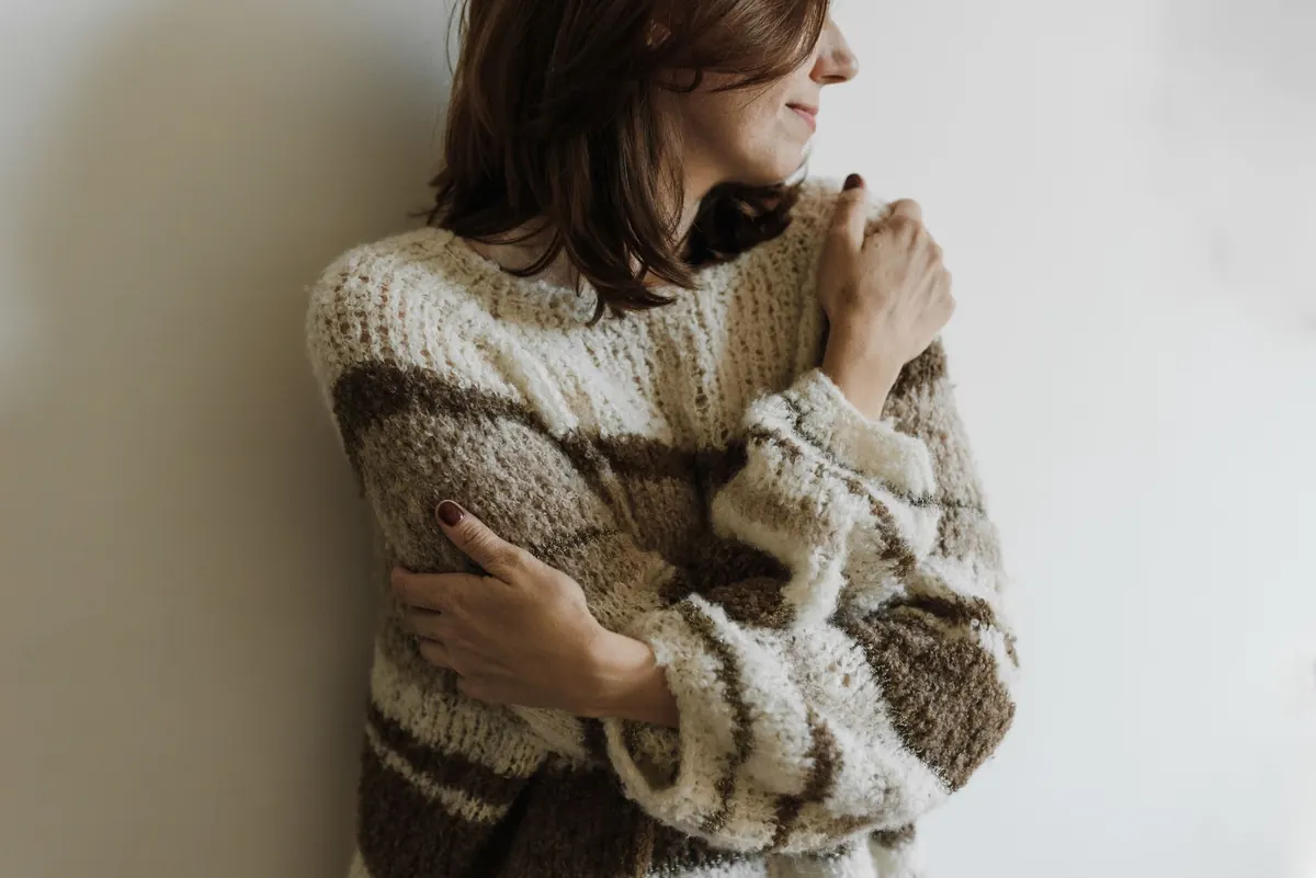 How to Layer a Chunky Cable-Knit Sweater Without Adding Bulk